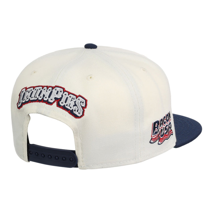 The Ebbets Field Lehigh Valley Ironpigs MiLB Snapback Ballcap is a white cap with a navy brim and adjustable strap, plus embroidered 