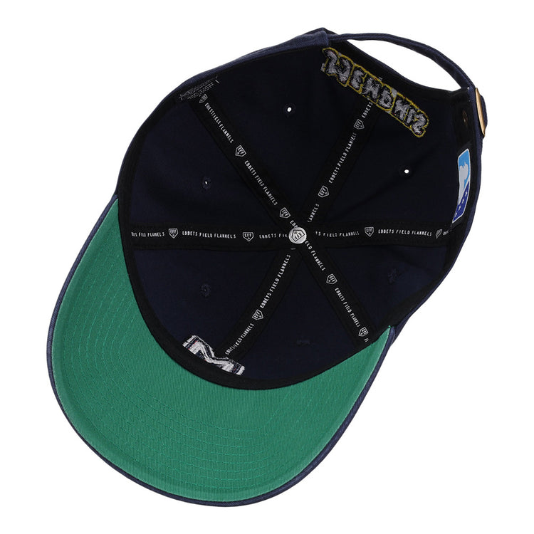 A look inside the Memphis Redbirds MiLB Dad Ballcap by Ebbets Field shows a navy interior with a green underbrim, black bands with white logos, visible sweatband and seam taping, plus an adjustable strap at the back.