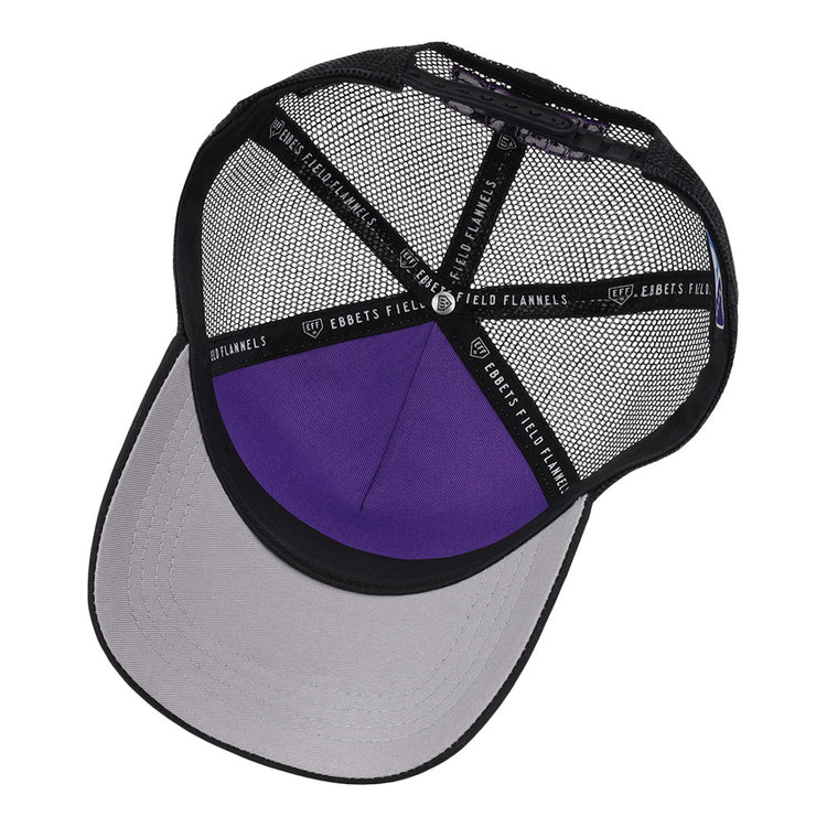 The interior of the Winston-Salem Dash MiLB Trucker Ballcap by Ebbets Field features black mesh, a purple crown, a gray underside brim, and black seam tape labeled 