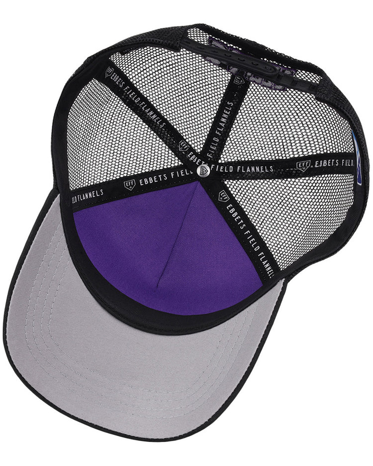 The interior of the Winston-Salem Dash MiLB Trucker Ballcap by Ebbets Field features black mesh, a purple crown, a gray underside brim, and black seam tape labeled 