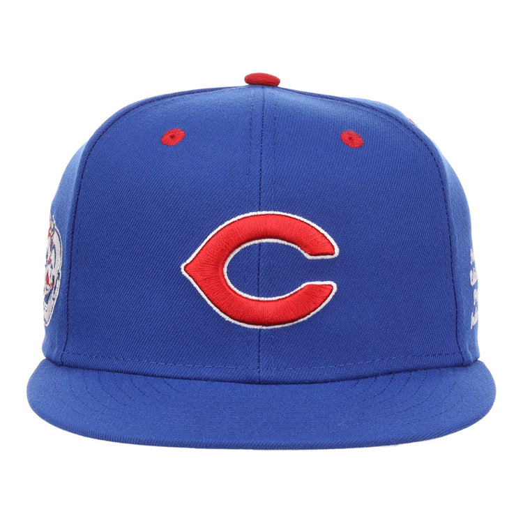 A blue Indianapolis Clowns NLB Varsity Fitted Ballcap by Ebbets Field, featuring a red and white C logo on the front and small red eyelets on top.