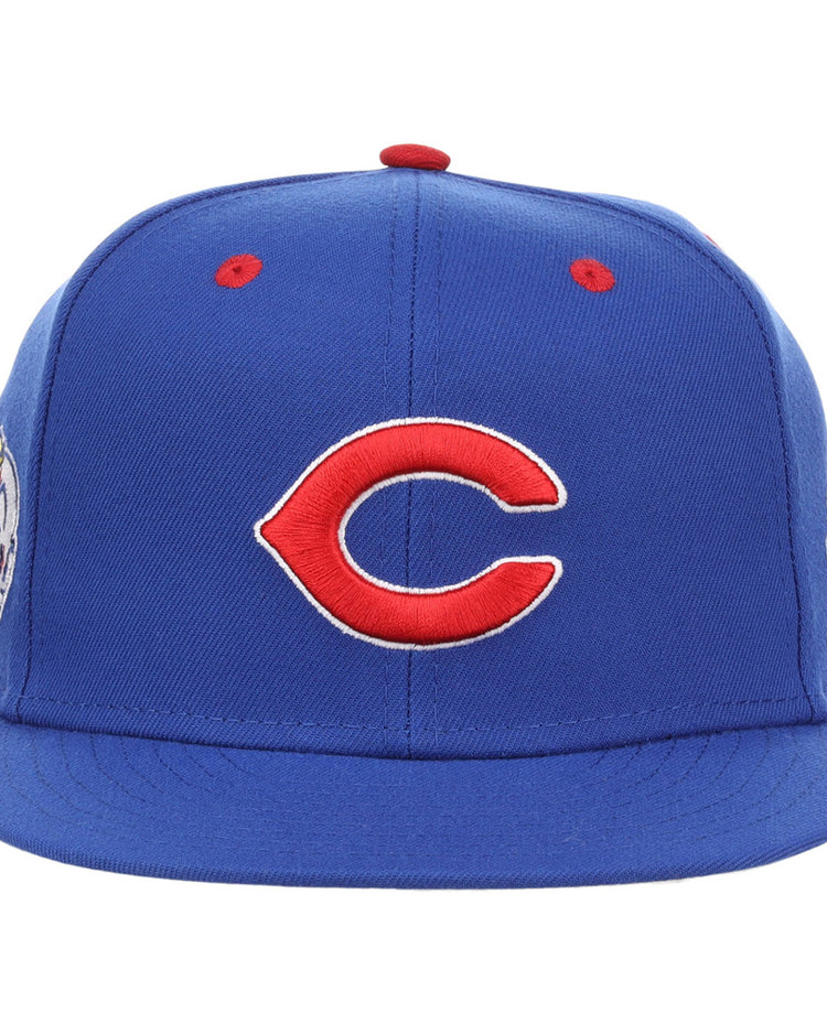 A blue Indianapolis Clowns NLB Varsity Fitted Ballcap by Ebbets Field, featuring a red and white C logo on the front and small red eyelets on top.