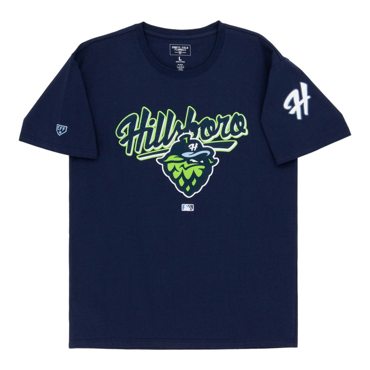 The Ebbets Field Hillsboro Hops MiLB Fashion Cotton Short Sleeve Tee is a navy blue shirt with 