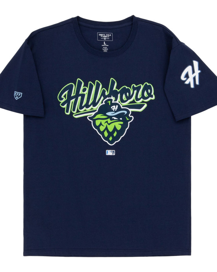 The Ebbets Field Hillsboro Hops MiLB Fashion Cotton Short Sleeve Tee is a navy blue shirt with 