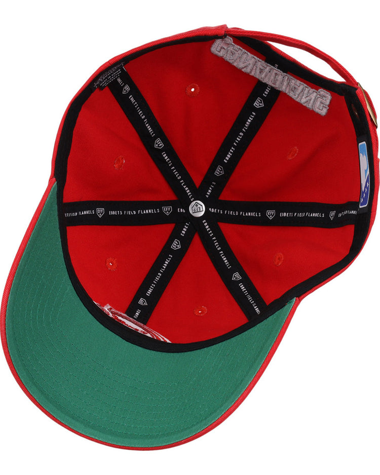 The underside of the Vancouver Canadians MiLB Dad Ballcap by Ebbets Field features a green brim, black inner taping with white text, and a side size sticker. The cap is shown upside down to display its interior details.