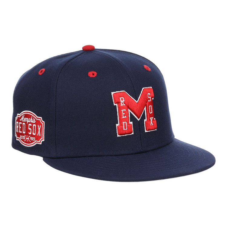 The Ebbets Field Memphis Red Sox NLB Varsity Fitted Ballcap features a navy base, red “M” and RED SOX embroidery on the front, red top accents, and a Memphis Red Sox patch on the side.