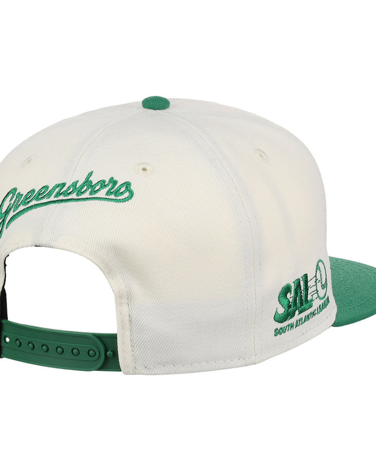 The Ebbets Field Greensboro Grasshoppers MiLB Snapback Ballcap features a white and green design, 