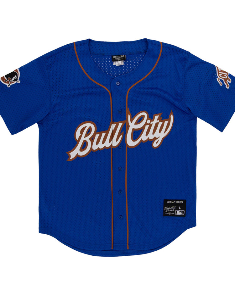 The Ebbets Field Durham Bulls MiLB Button Down Jersey is a blue jersey with brown trim, 