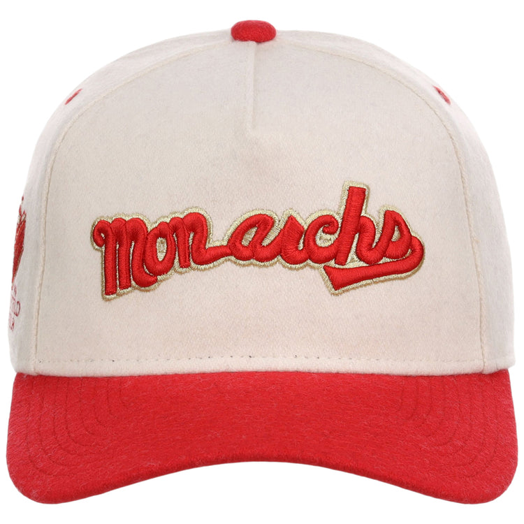 The Ebbets Field Kansas City Monarchs NLB Ballpark A-Frame Ballcap features a cream color with a red brim and stitching. 