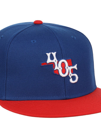 The Ebbets Field Oklahoma City Dodgers MiLB Two Tone Snapback Ballcap features blue and red colors, a 405 front logo, a red top button, and a white star with 