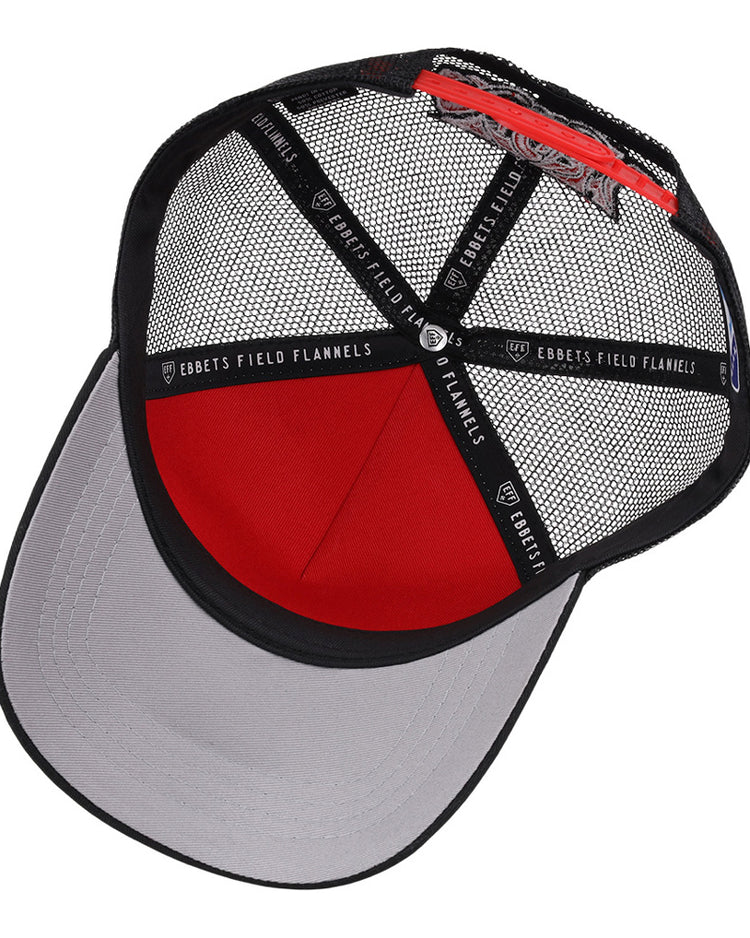 The Lake Elsinore Storm MiLB Trucker Ballcap by Ebbets Field features a red and black mesh crown, gray curved brim, black interior bands with EBBETS FIELD FLANNELS labeling, and an adjustable back strap.