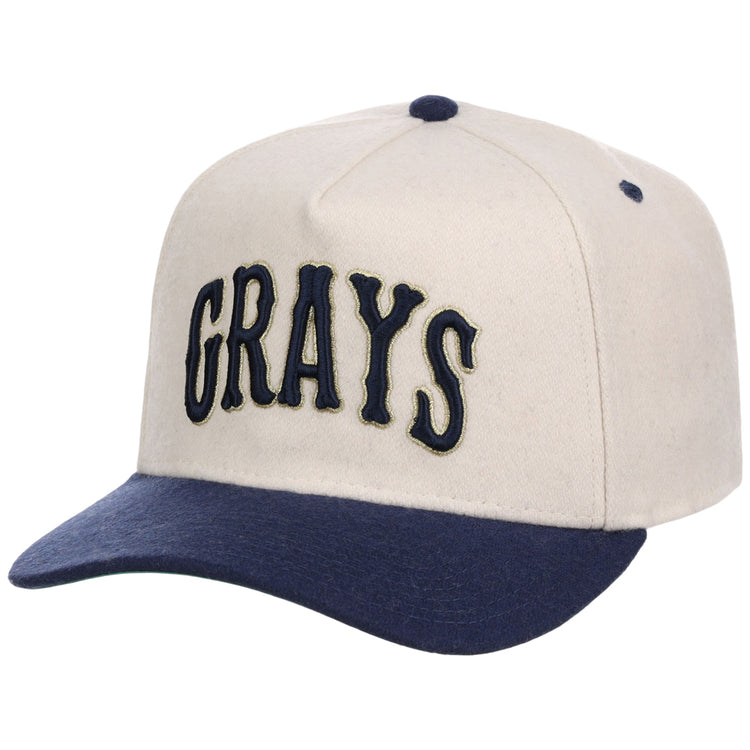 The Ebbets Field Homestead Grays NLB Ballpark A-Frame Ballcap is cream-colored with a navy brim and button, and features 