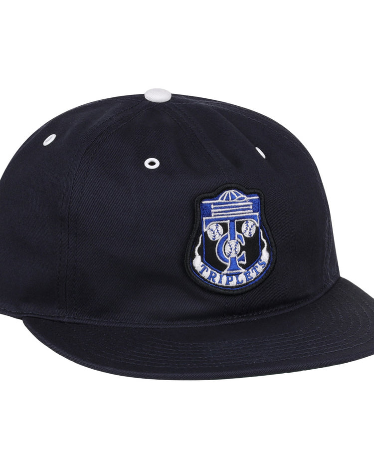 The Ebbets Field Binghamton Triplets MiLB Cotton Ballcap is a black flat-brim cap with white eyelets and top button, featuring a blue and white front patch embroidered with 
