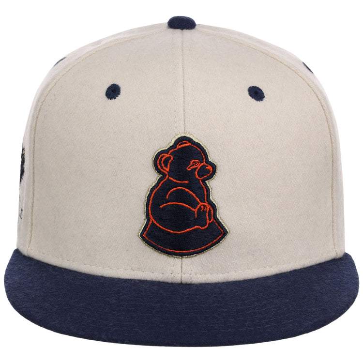 The San Francisco Sea Lions NLB Ballpark Fitted Ballcap by Ebbets Field features a beige crown, navy blue brim and button, and an embroidered dark blue and orange bear outline on the front.