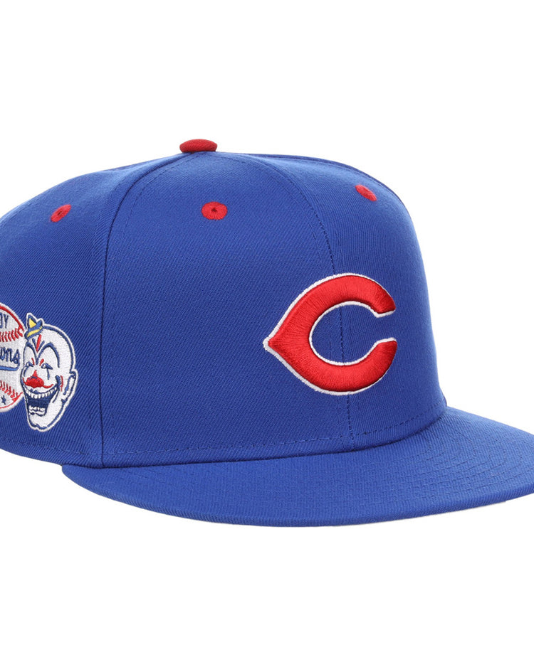 The Ebbets Field Indianapolis Clowns NLB Varsity Fitted Ballcap features a red “C” logo on the front, a clown face with baseball and “Browning” patch on the side, and red ventilation eyelets on the crown.