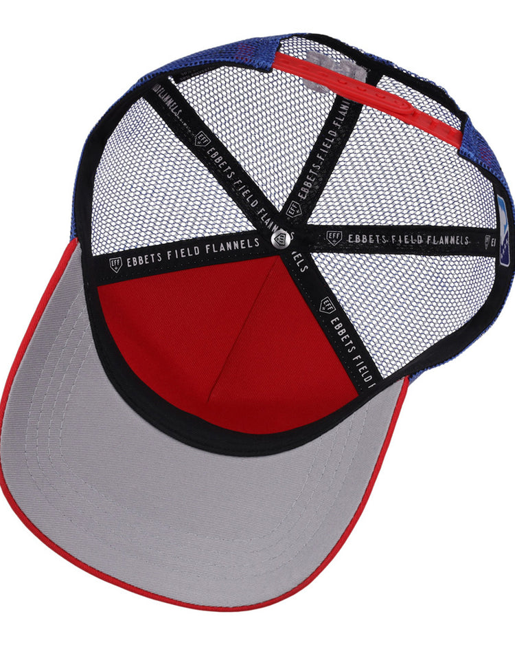 A top-down view of the Oklahoma City 89Ers MiLB Trucker Ballcap by Ebbets Field, featuring blue and red mesh, black sweatbands with 