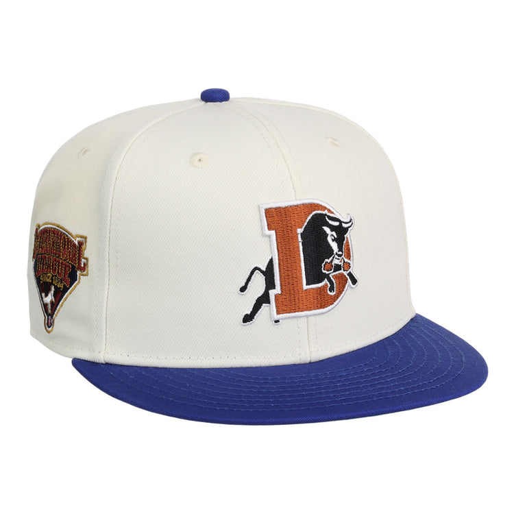 The Ebbets Field Durham Bulls MiLB Two Tone Snapback Ballcap features a white crown, blue brim, bold orange and black 