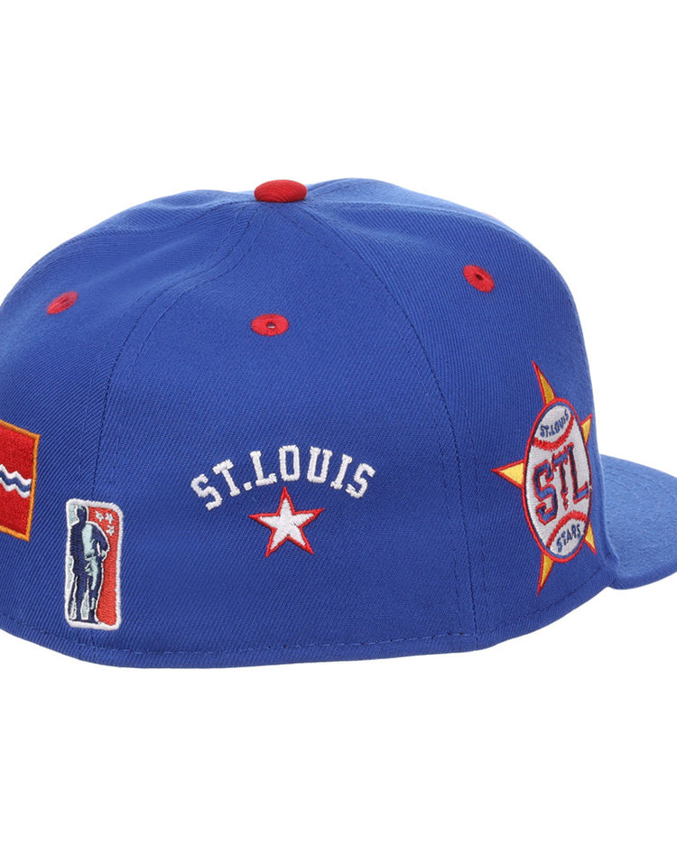 The Ebbets Field St. Louis Stars NLB Varsity Fitted Ballcap is a blue cap with 