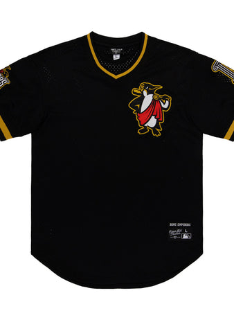 The Ebbets Field Rome Emperors MiLB V-Neck Jersey is a black jersey with yellow trim, featuring a penguin cartoon on the chest, a 