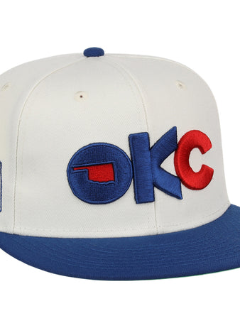 The Oklahoma City Dodgers MiLB Snapback Ballcap by Ebbets Field is a white cap with a blue brim, 