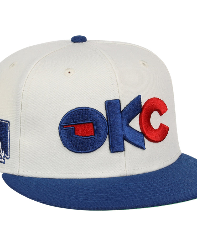 The Oklahoma City Dodgers MiLB Snapback Ballcap by Ebbets Field is a white cap with a blue brim, 