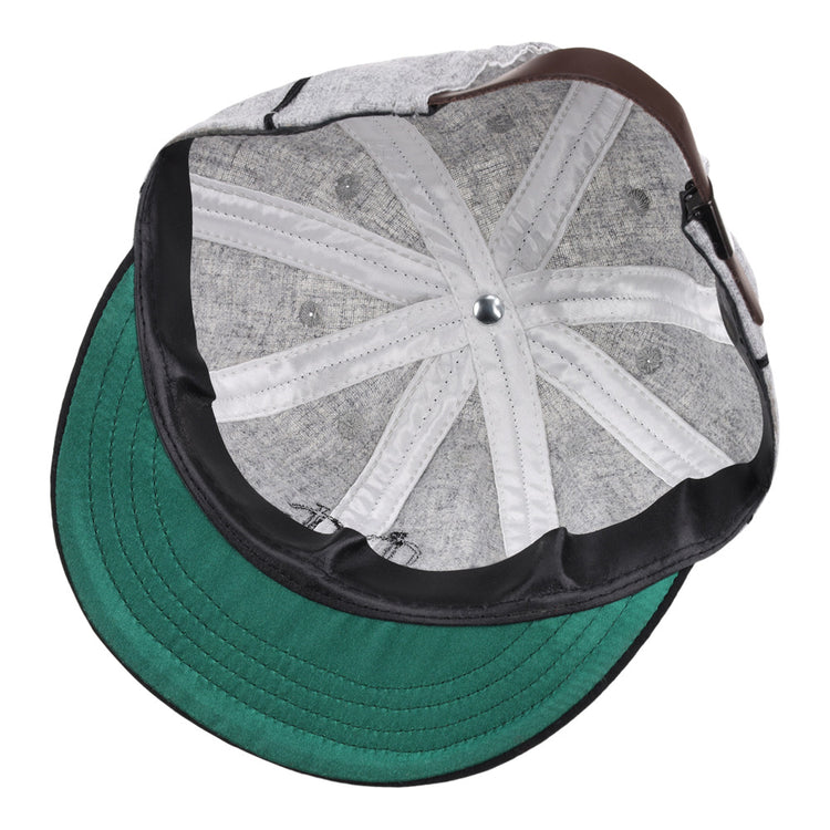 A close-up view of the inside of the Ebbets Field Chicago Union Giants NLB 1905 Vintage 8-Panel Ballcap, highlighting its green brim, stitching details, metal top button, and sweatband.