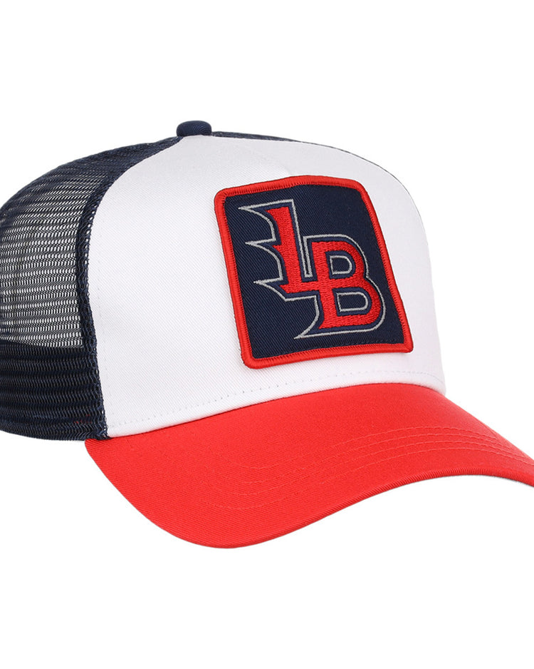 The Ebbets Field Louisville Bats MiLB Trucker Ballcap features a white front, black mesh back, red bill, and a square “LB” patch in red and white on a navy background.