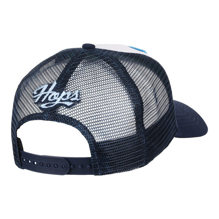 The Hillsboro Hops MiLB Trucker Ballcap by Ebbets Field is a navy blue mesh snapback, shown from the back with “Hops” embroidered in white above the adjustable strap.