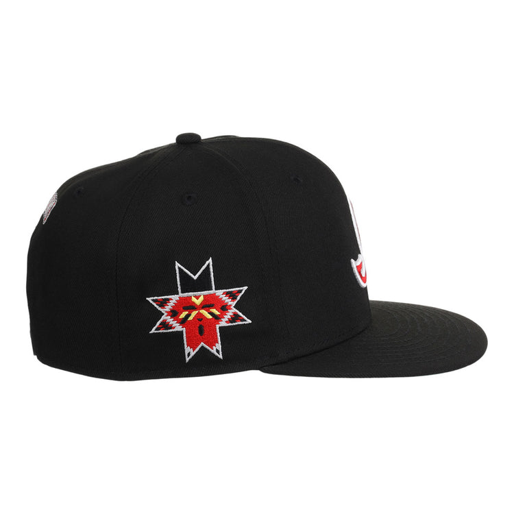 The Ebbets Field Indianapolis Indians MiLB Snapback Ballcap is a black flat-brim cap with a vibrant embroidered red and yellow animal face inside a star on the left side.