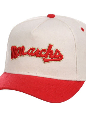 The Ebbets Field Kansas City Monarchs NLB Ballpark A-Frame Ballcap is cream-colored with a red brim and button, and features 