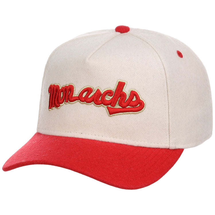 The Ebbets Field Kansas City Monarchs NLB Ballpark A-Frame Ballcap is cream-colored with a red brim and button, and features 