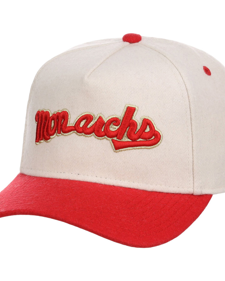 The Ebbets Field Kansas City Monarchs NLB Ballpark A-Frame Ballcap is cream-colored with a red brim and button, and features 
