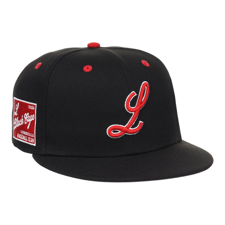 The Louisville Black Caps NLB Varsity Fitted Ballcap by Ebbets Field is a black cap featuring a red and white embroidered “L,” red button and eyelets, plus a red side patch reading “L League Caps, Louisville Baseball Club.”.