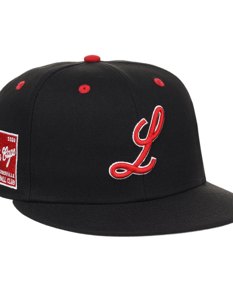 The Louisville Black Caps NLB Varsity Fitted Ballcap by Ebbets Field is a black cap featuring a red and white embroidered “L,” red button and eyelets, plus a red side patch reading “L League Caps, Louisville Baseball Club.”.