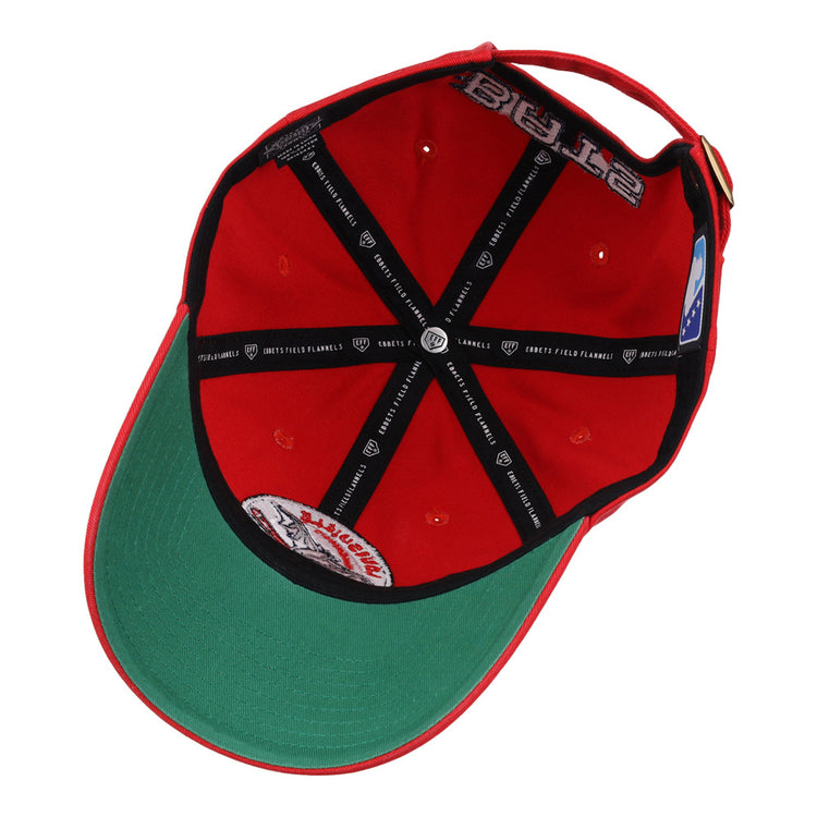 The Louisville Bats MiLB Dad Ballcap by Ebbets Field features a red, upside-down design with a green brim underside, black lining, white label, ventilation holes, and an adjustable back strap.