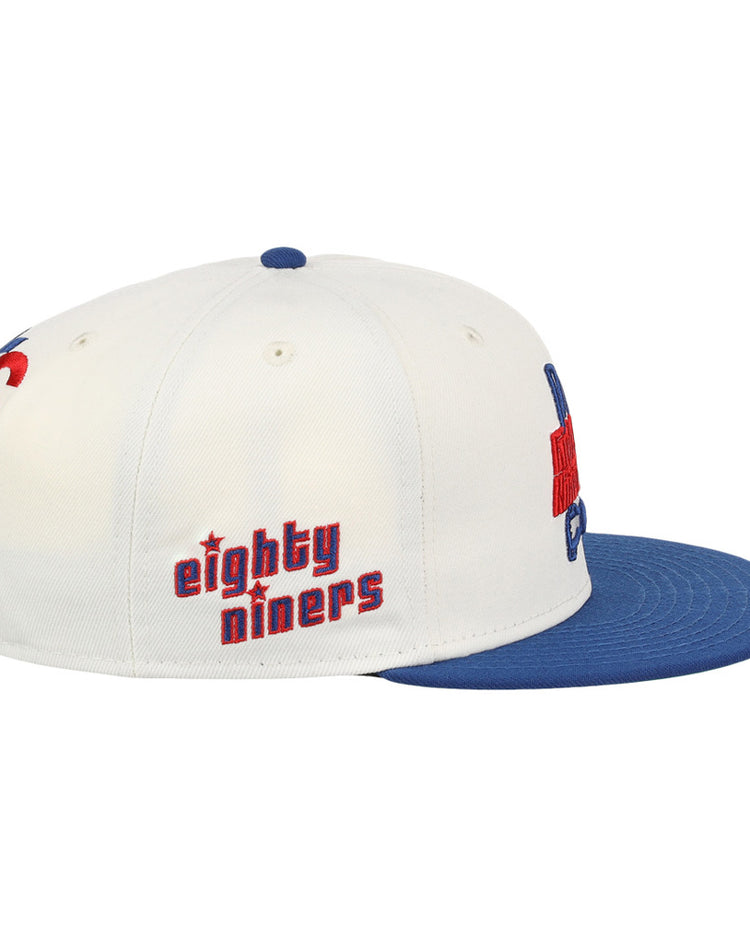 The Ebbets Field Oklahoma City 89Ers MiLB Logo Wordmark Snapback Ballcap is a white cap with a blue flat brim and 