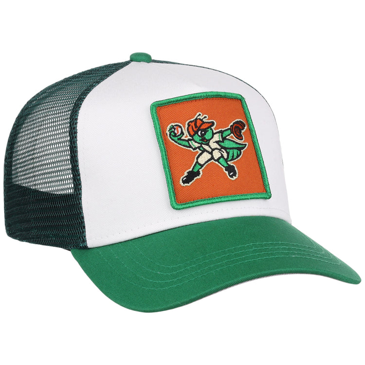 The Greensboro Grasshoppers MiLB Trucker Ballcap by Ebbets Field is a green and white mesh-back hat featuring a front patch with a cartoon leprechaun mascot in a fighting stance on an orange background.