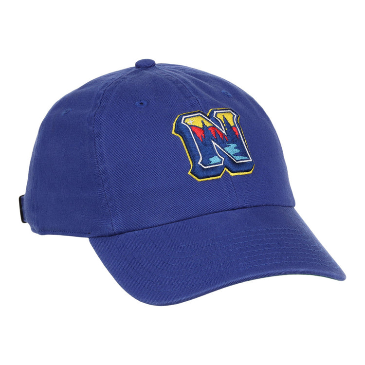The Ebbets Field Northwest Arkansas Naturals MiLB Dad Ballcap is a blue hat with a colorful, stylized letter N embroidered on the front.