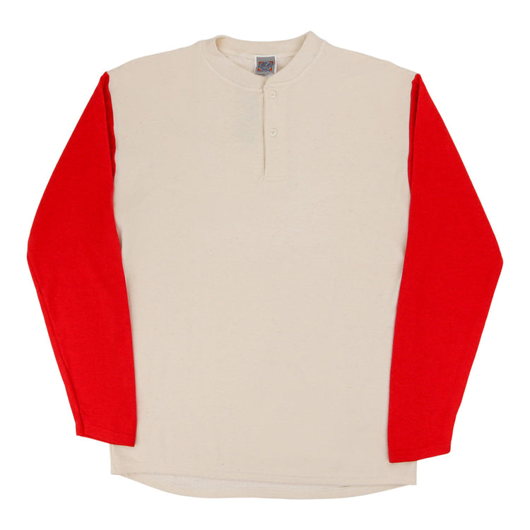 The Ebbets Field Fungo Shirt - Red Long Sleeves features a cream body, bold red sleeves, and a short button placket at the neck. The shirt is displayed flat on a white background.