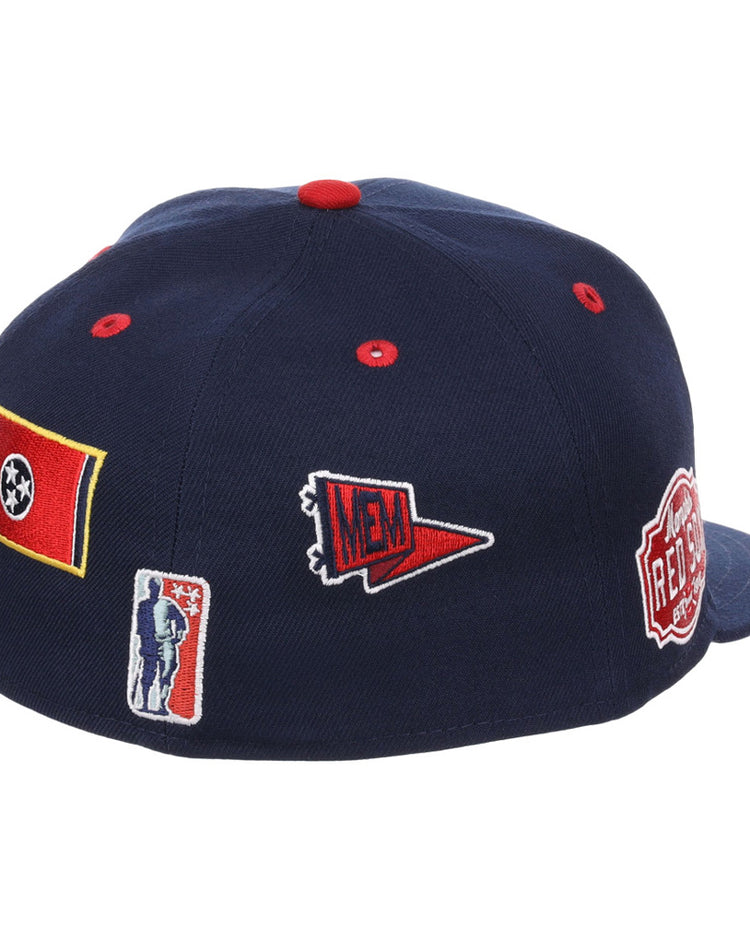 The Ebbets Field Memphis Red Sox NLB Varsity Fitted Ballcap is a navy blue cap with red button and eyelets, featuring patches of the Tennessee flag, MEM pennant, silhouetted figure, and REBEL badge on the back and side.