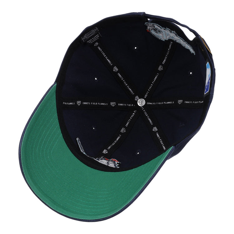 The Ebbets Field Columbus Clippers MiLB Dad Ballcap features a green brim, embroidered grey mice, small red dots on the inner navy panels, and black logo-printed taping across the inside.