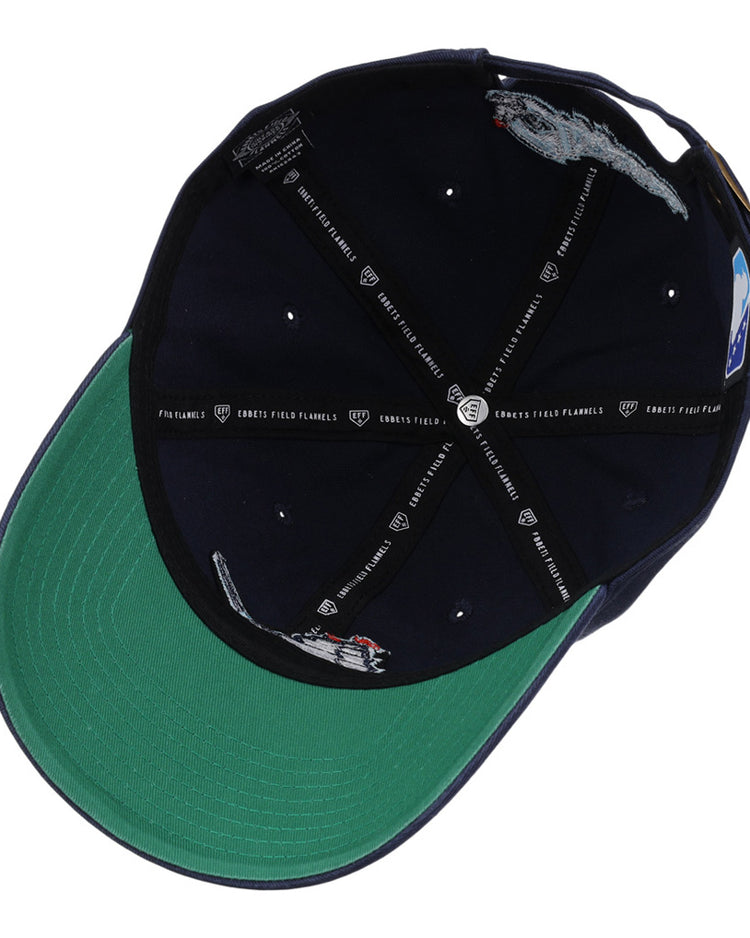 The Ebbets Field Columbus Clippers MiLB Dad Ballcap features a green brim, embroidered grey mice, small red dots on the inner navy panels, and black logo-printed taping across the inside.