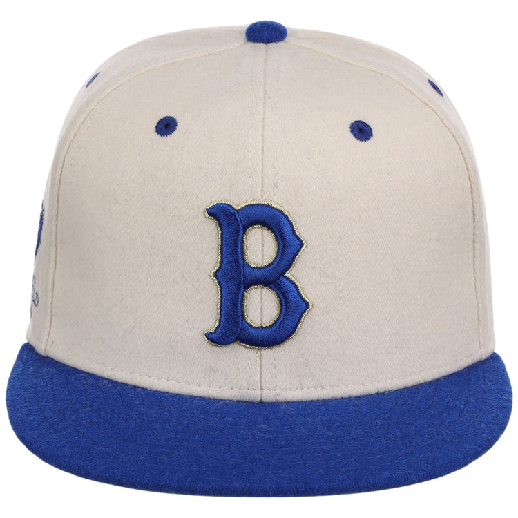 The Ebbets Field Brooklyn Royal Giants NLB Ballpark Fitted Ballcap is cream with a blue brim and accents, showcasing a large blue 