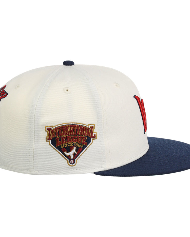 The Ebbets Field Worcester Red Sox MiLB Snapback Ballcap is white with a navy brim, a red letter logo on the front, 