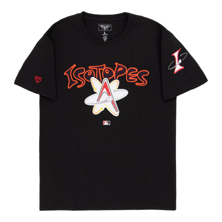 The Ebbets Field Albuquerque Isotopes MiLB Fashion Cotton Short Sleeve Tee is a black shirt with bold Isotopes text and an atomic logo, a red “L” atom logo on the left sleeve, and an MLB logo near the bottom center.