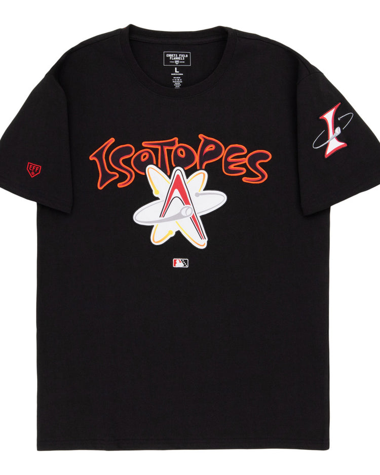 The Ebbets Field Albuquerque Isotopes MiLB Fashion Cotton Short Sleeve Tee is a black shirt with bold Isotopes text and an atomic logo, a red “L” atom logo on the left sleeve, and an MLB logo near the bottom center.