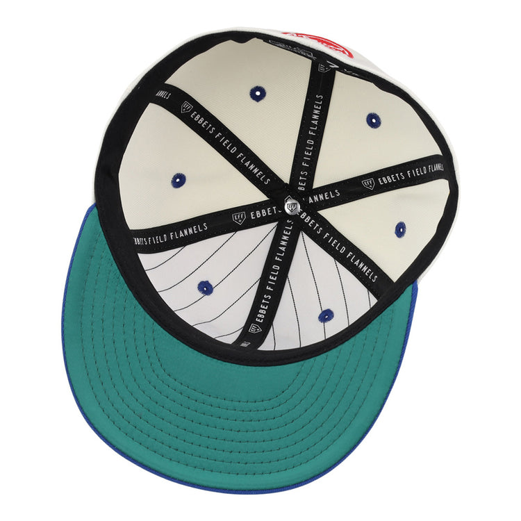 Inside view of the Ebbets Field Santurce Cangrejeros Chainstitch Fitted Ballcap reveals a green underbrim, white crown with vertical black pinstripes, blue rivets, and black taping labeled 