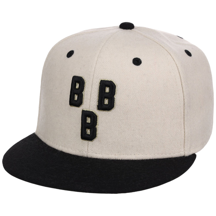 The Ebbets Field Birmingham Black Barons NLB Ballpark Fitted Ballcap features a beige crown, black brim and eyelets, plus three black Bs outlined in white on the front.