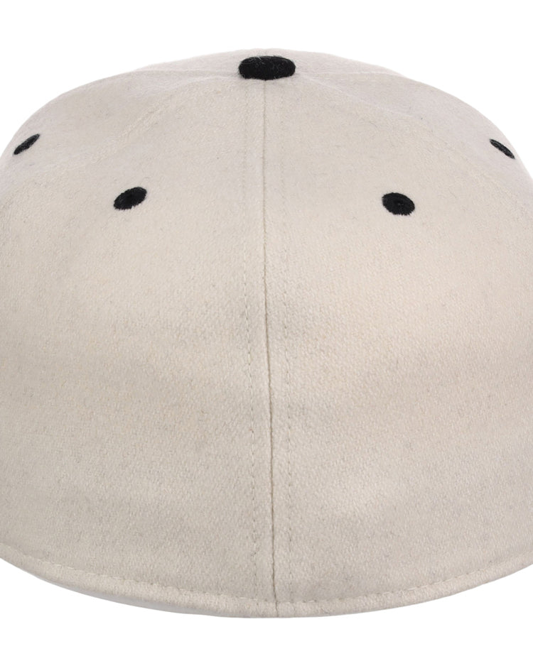 The Ebbets Field Birmingham Black Barons NLB Ballpark Fitted Ballcap is beige, seen from the back, with six black ventilation eyelets and a small black button on top.