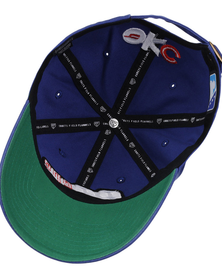 The underside of the Ebbets Field Oklahoma City 89Ers MiLB Dad Ballcap shows a green bill, black interior lining, sewn labels, embroidered 